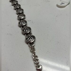 Heart bracelet . Beautiful detail at clasp and dangling charm